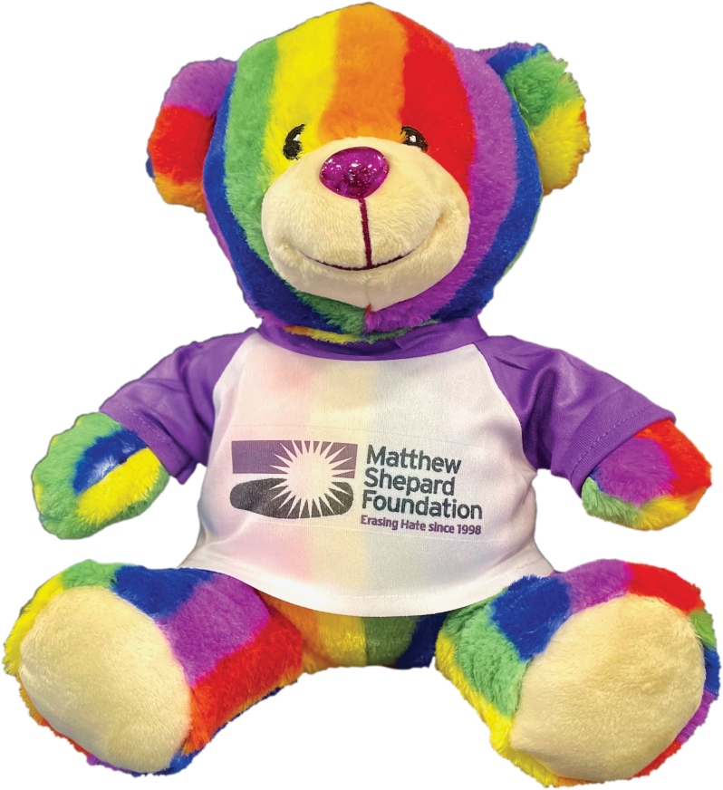 Product Description: The iconic MSF rainbow teddy bear, frequently seen at our galas, is now available for purchase online!This plush bear comes wearing a Matthew Shepard Foundation branded t-shirt. Shipping is included.</br></br>*Note: This teddy bear is not signed.</br> MSF Rainbow Teddy Bear